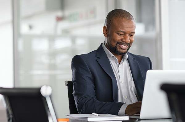 man viewing home banking on laptop